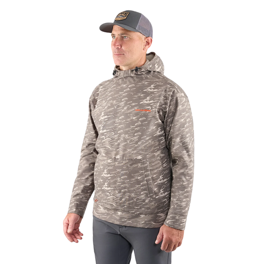 Man wearing a camouflage hoodie and cap on a white background