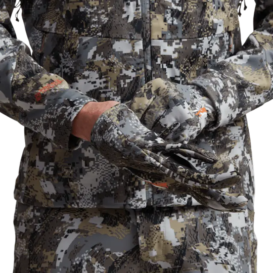 Camouflage hunting outfit with gloves on a white background