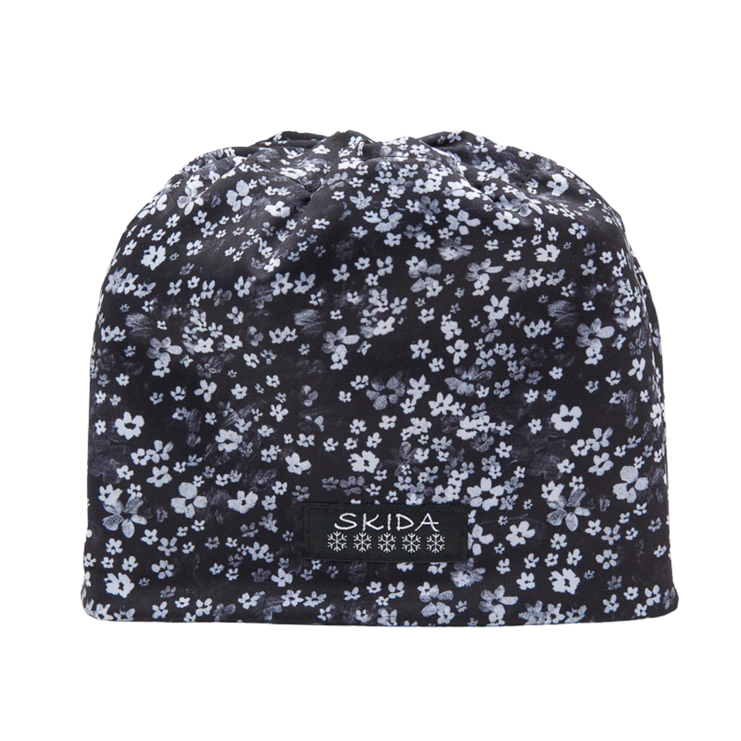 Floral patterned beanie with 'Skida' logo on a white background