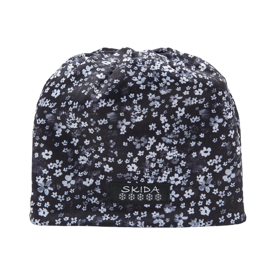 Floral patterned beanie with 'Skida' logo on a white background