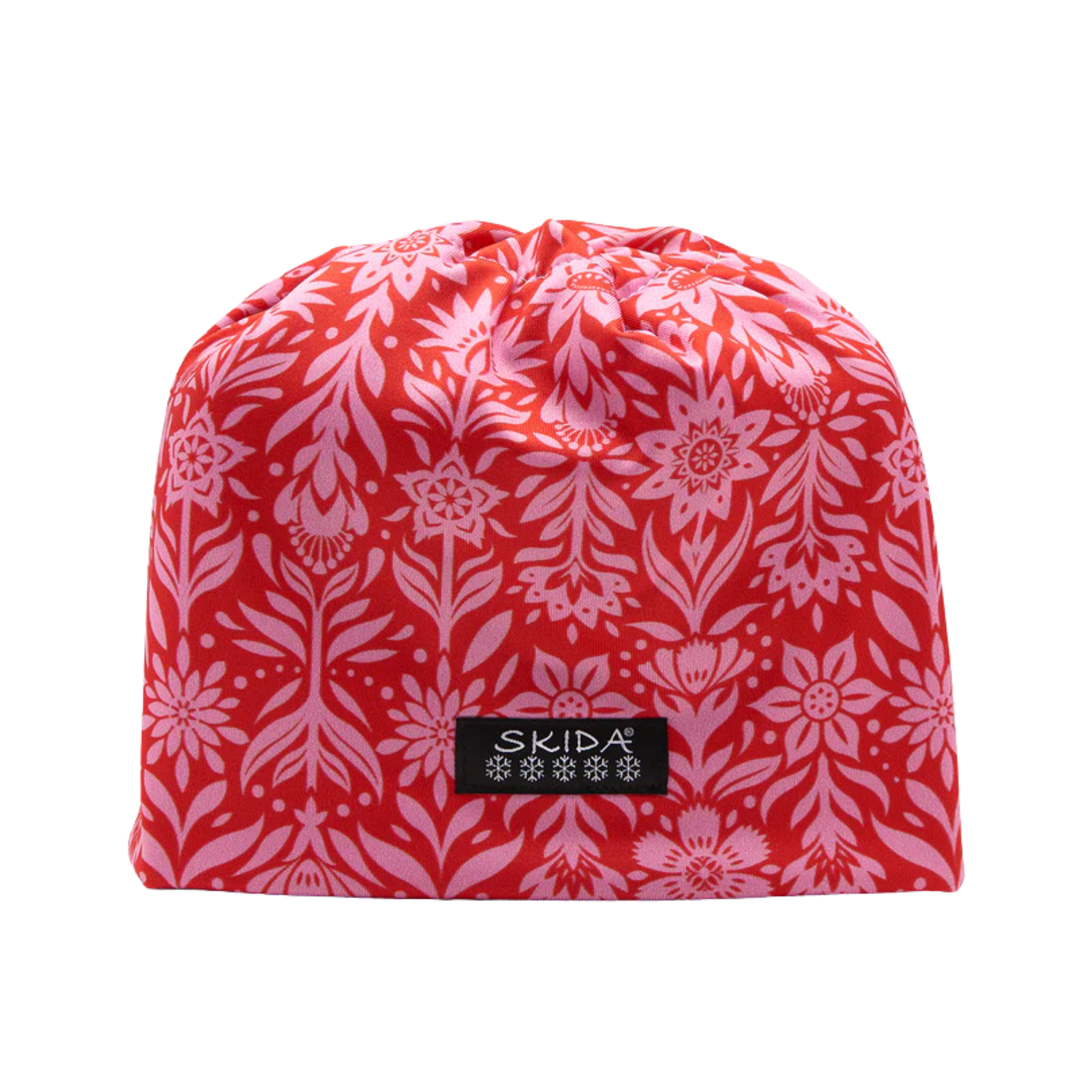 Red and white floral patterned drawstring bag with 'Skida' logo on a white background