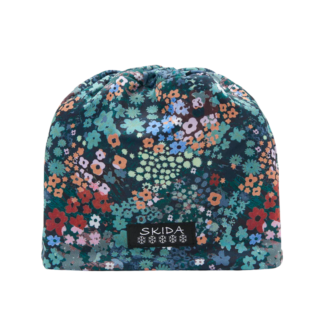 Floral patterned beanie with 'Skida' logo on a white background