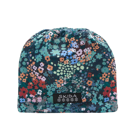 Floral patterned beanie with 'Skida' logo on a white background