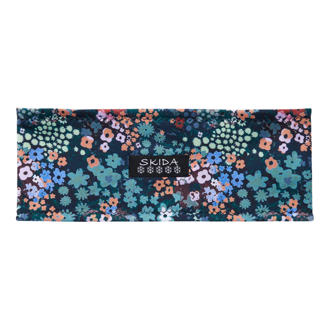 Bitterroot green flower print headband with skida black logo on white background