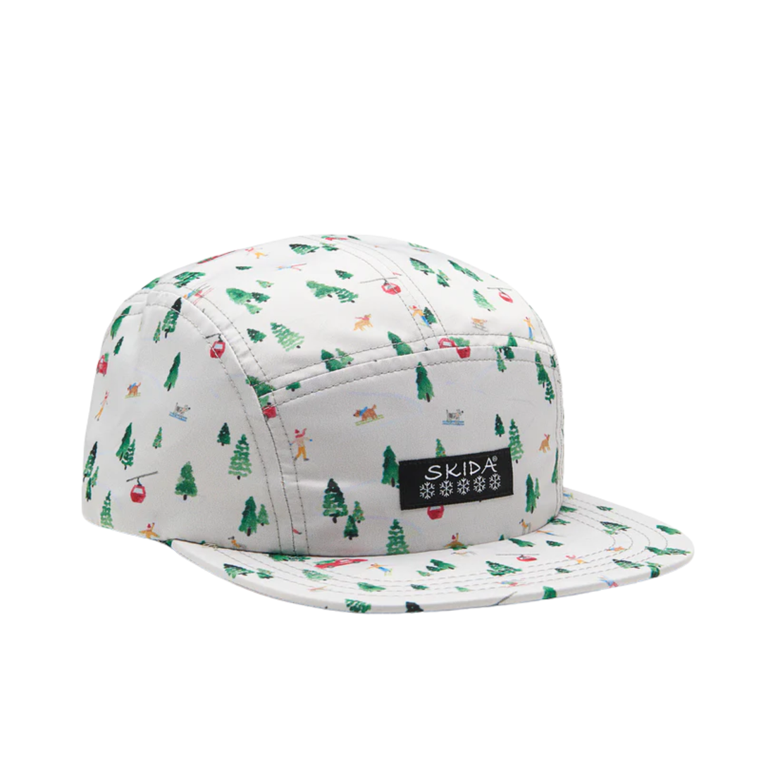 Skida Original Brim Hat - Nordland white and green pine tree print on white background with black Skida logo on hat