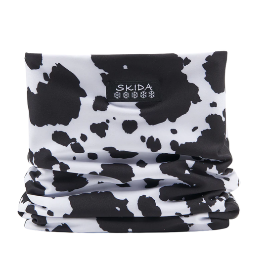 Black and white patterned neck gaiter with 'Skida' branding on a white background