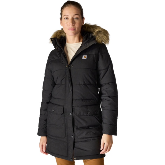 Woman wearing black Carhartt parka with a fur hood collar on a white background