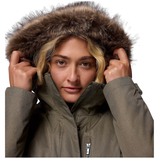 Woman having her hood up wearing Columbia Women's Suttle Mountain Long Insulated Jacket - Stone Green on white background