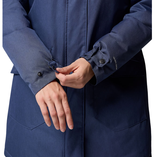 woman wearing Columbia Women's Suttle Mountain Long Insulated Jacket - Collegiate Navy on white background lose up of model adjusting wrist closure