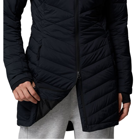 bottom portion of jacket showing two way split zipper Woman wearing Columbia Women's Joy Peak II Mid Hooded Jacket - Black on white background