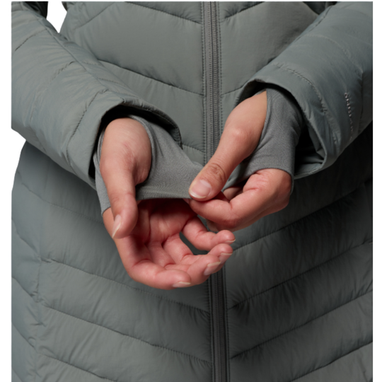 woman wearing Columbia Women's Joy Peak II Mid Hooded Jacket - Sedona Sage on white background zoomed in to adjusting wrist extension 