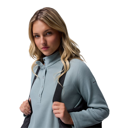 close up of suspender attached to jacket on woman wearing Columbia Women's Amaze Puff Mid Hooded Jacket - Black on white background
