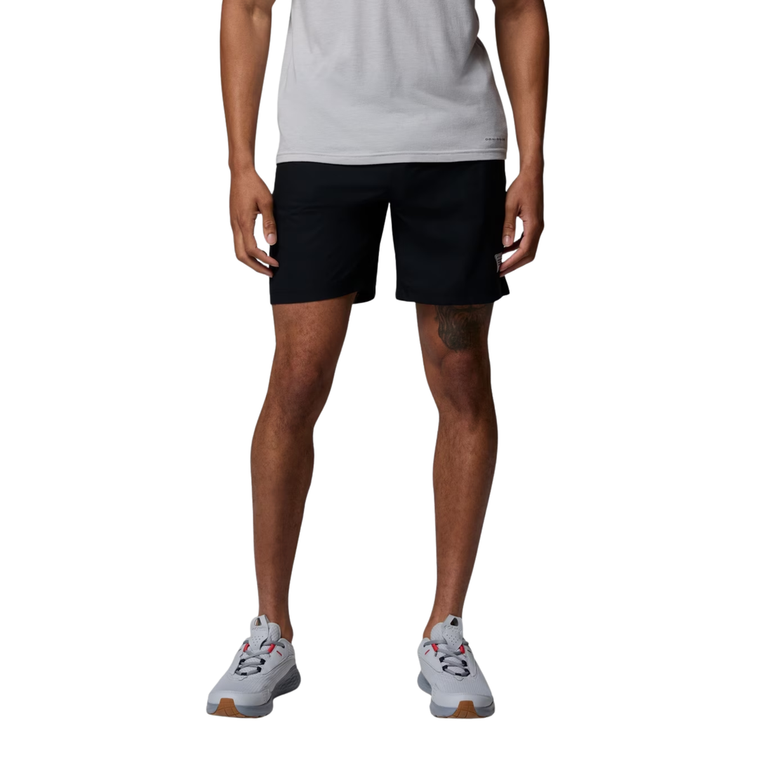 Man wearing Columbia Men's PFG Rambler Water Shorts - Black on white background