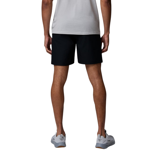 Man wearing Columbia Men's PFG Rambler Water Shorts - Black on white background