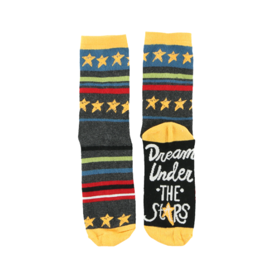 A pair of crew socks with a dark gray base, featuring yellow stars, blue, green, and red stripes, and the phrase 'Dream Under THE Stars' in white on the sole.