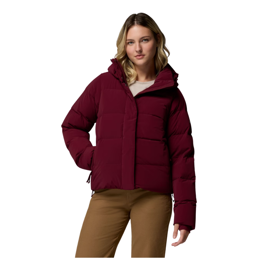 Woman wearing Columbia Women's Amaze Puff Hooded Jacket - Rich Wine on a plain white background