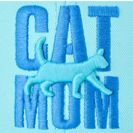 Embroidered design on fabric with 'CAT MOM' text and a cat illustration.
