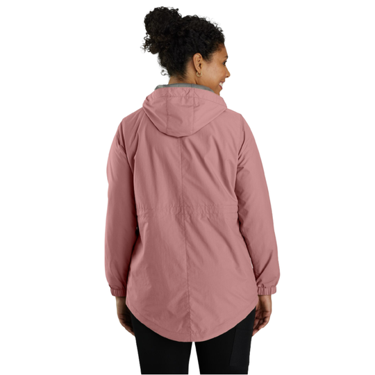 A woman viewed from the back wearing a dusty rose hooded jacket and black pants against a plain white background.