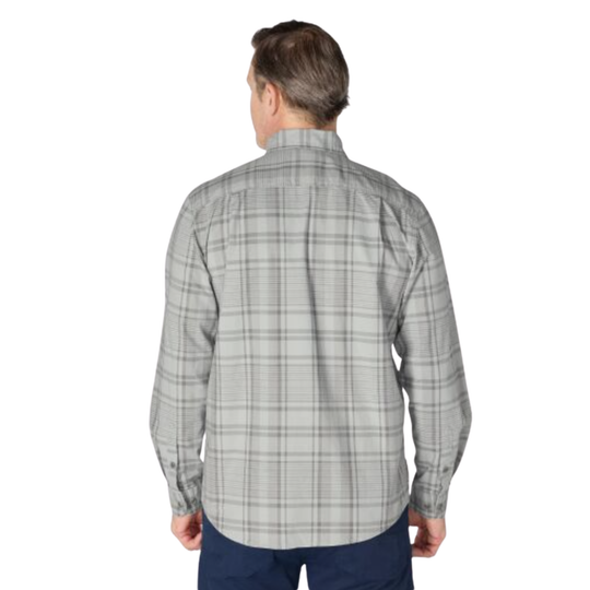 A man viewed from the back wearing a light gray and white plaid long-sleeve button-down shirt, paired with navy blue pants, against a plain white background.