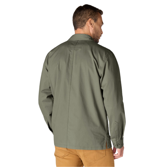 A man wearing an olive green long-sleeve button-up shirt, shown from the back, paired with tan pants against a plain white background.