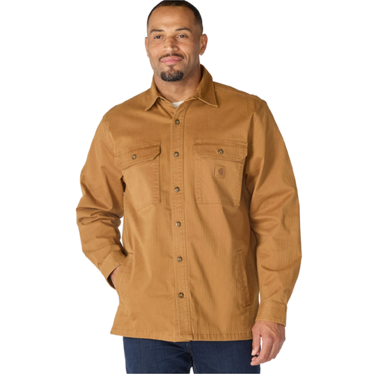 A man wearing a tan Carhartt work shirt jacket with two chest pockets, shown against a plain white background.