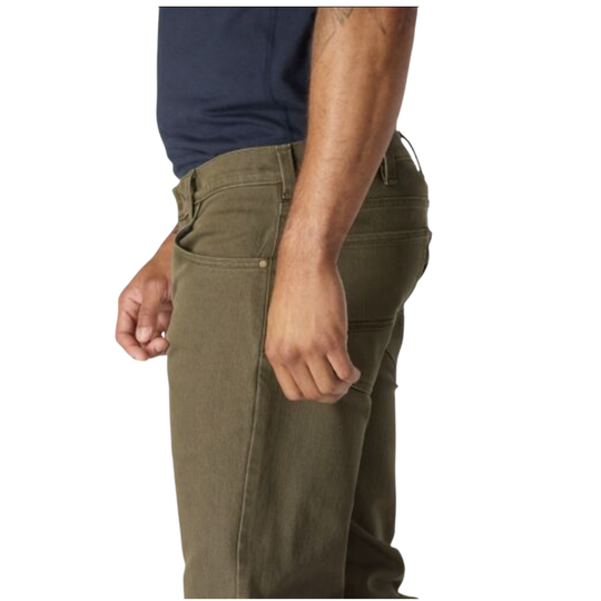 A side profile view of a person wearing olive green pants and a navy blue shirt against a plain white background.