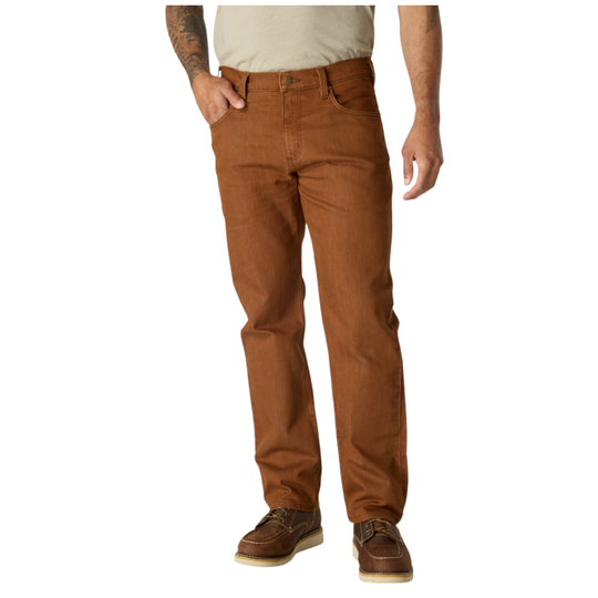 A person wearing brown straight-leg jeans, a light beige t-shirt, and brown leather shoes, shown from the waist down against a plain white background.