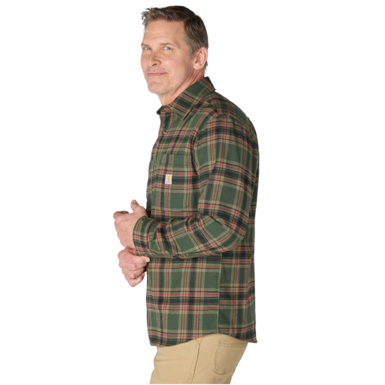 A man wearing a green plaid long-sleeve button-down shirt with tan pants, shown from a side profile against a plain white background.