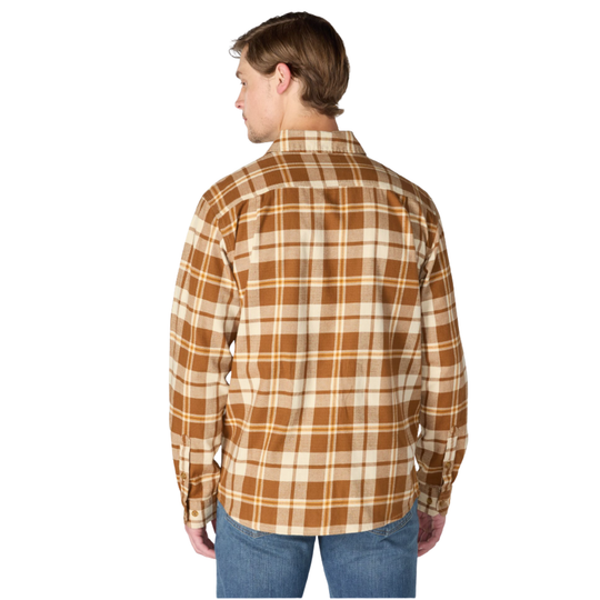 A man viewed from the back wearing a long-sleeve plaid button-up shirt in brown and beige with blue jeans, set against a plain white background.