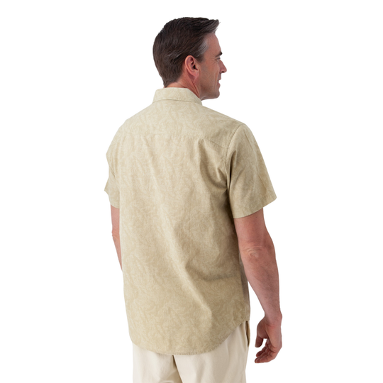 Man wearing a beige short-sleeve shirt on a white background