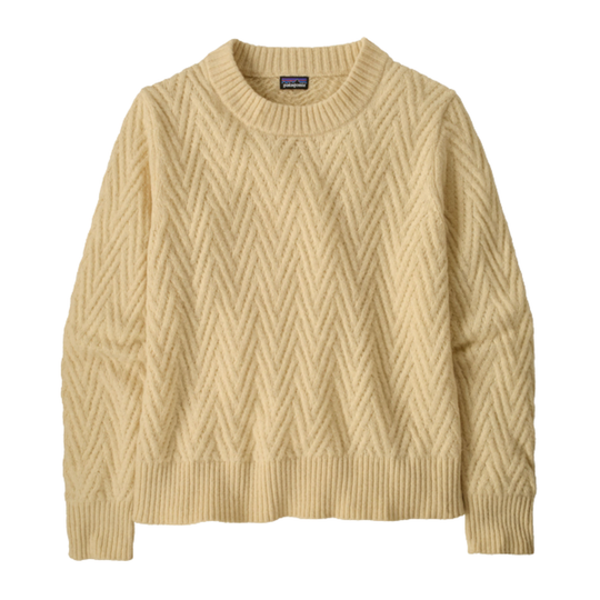 Beige cable knit sweater on a light beige background