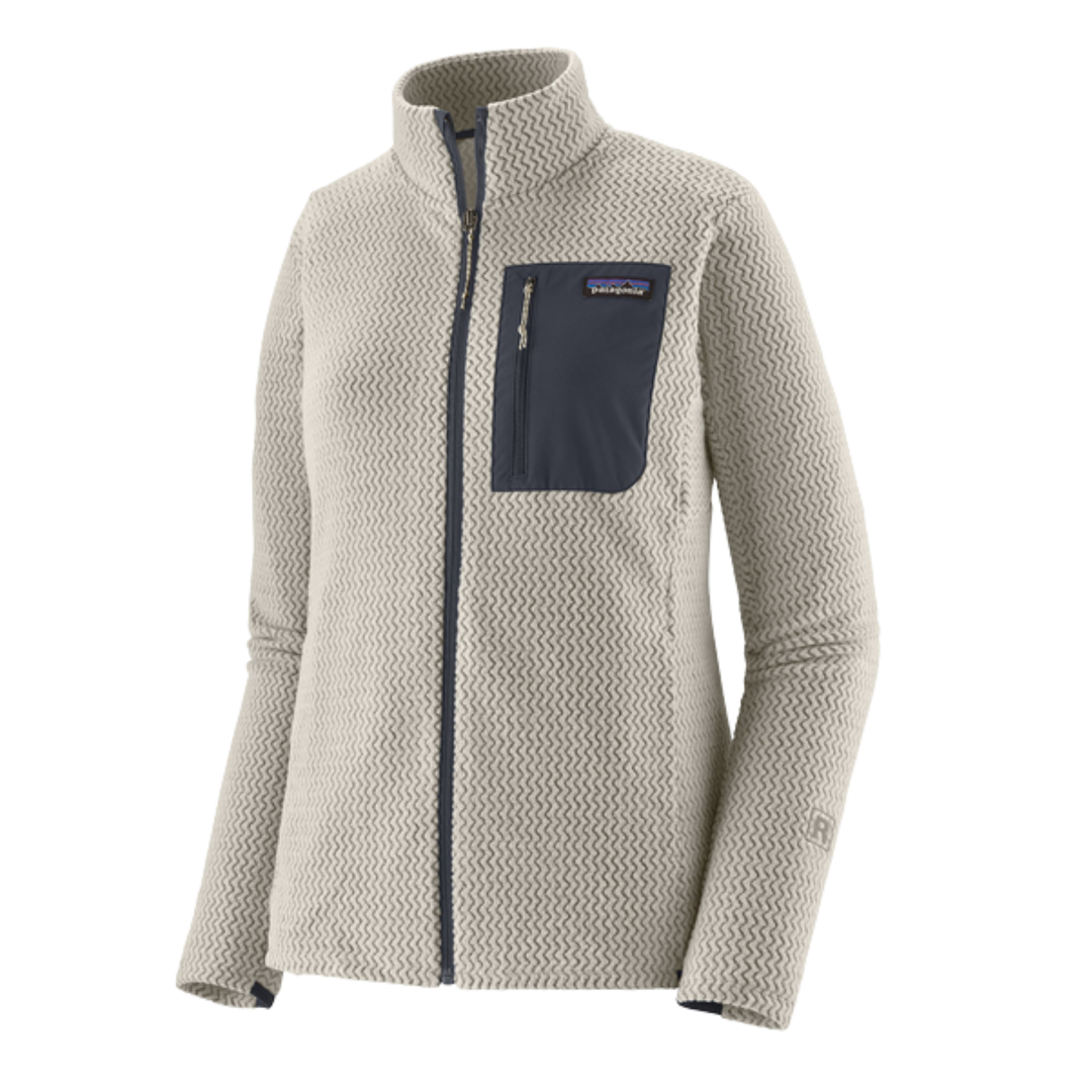 A women's Patagonia fleece jacket in a textured light beige color, featuring a dark gray zippered chest pocket and matching dark gray zipper details, shown on a plain white background.