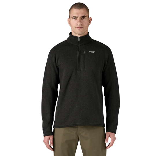 Man wearing a black pullover with a brand logo on a white background