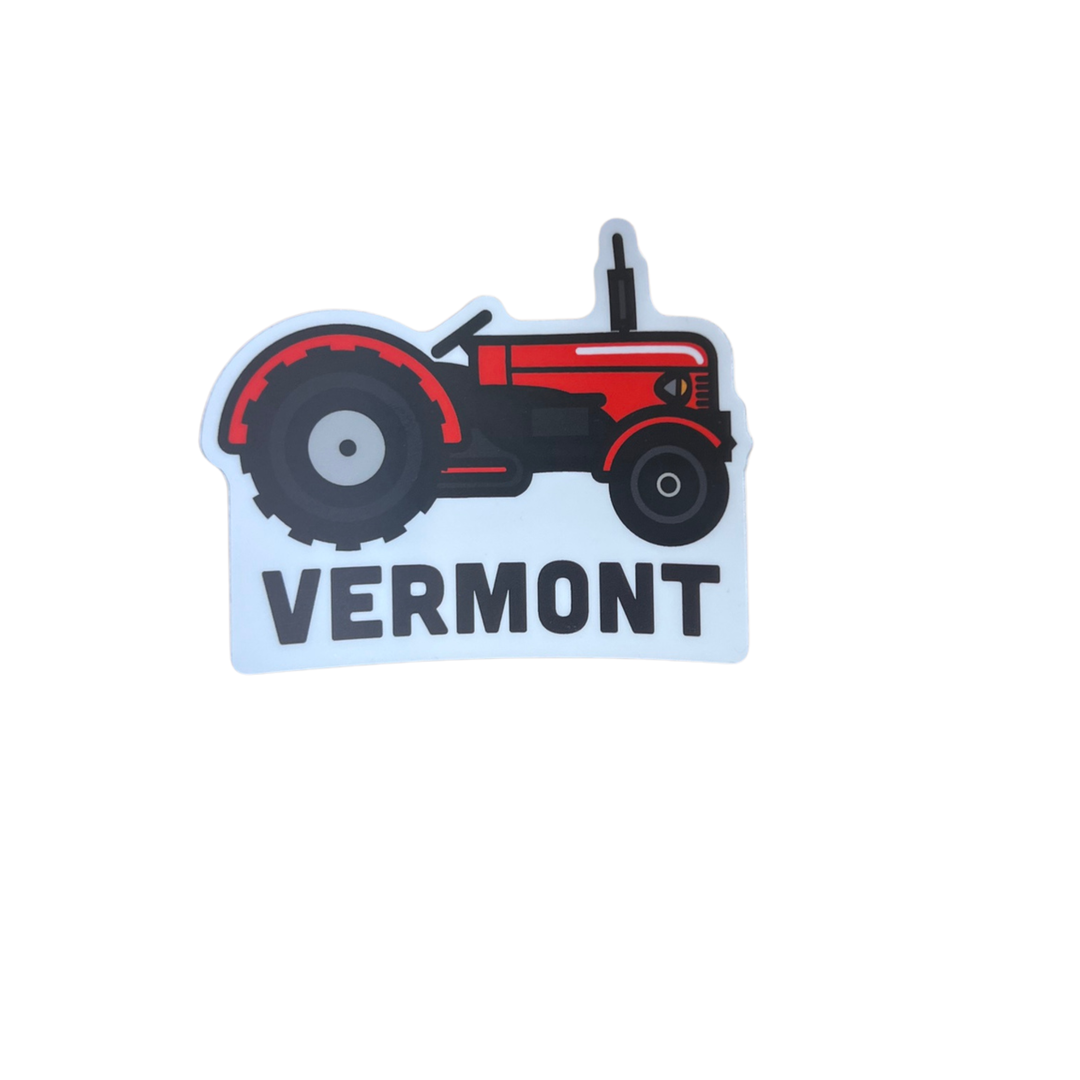 A die-cut sticker featuring a red and black vintage tractor above the word 'VERMONT' in bold black letters on a white background.
