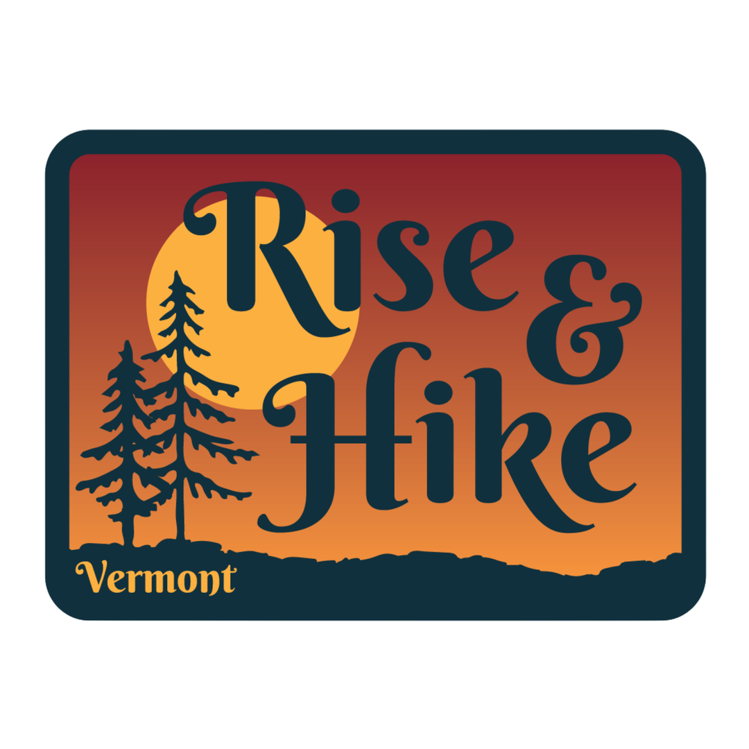 A rectangular graphic with rounded corners featuring the words “Rise & Hike” in large dark navy lettering over an orange-to-red sunset gradient, with a yellow sun, two dark pine trees, and “Vermont” in yellow at the bottom left.