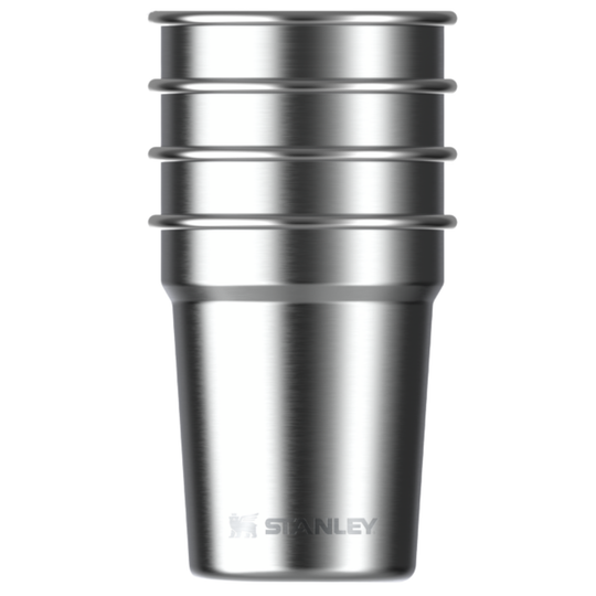 A stainless steel travel tumbler with a brushed metal finish, featuring a flared lid with horizontal ridges and the Stanley logo near the base, shown on a plain white background.