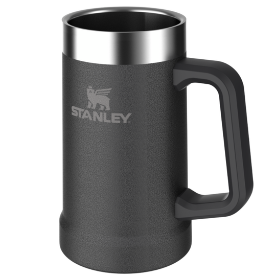A dark gray textured Stanley mug with a stainless steel rim and a black handle, shown on a plain white background.