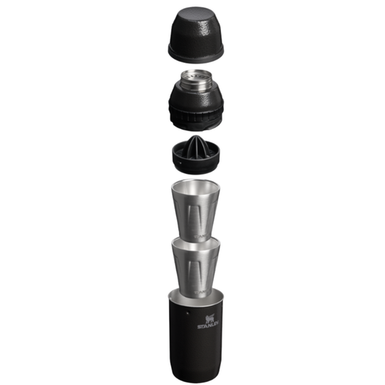 A metal and black manual citrus juicer shown in an exploded vertical view, displaying its separated components including the top lid, filter cone, and metal chutes on a solid white background.