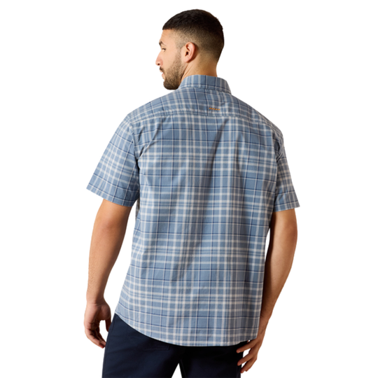 Man wearing a blue plaid short-sleeve shirt on a white background