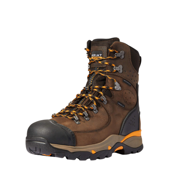 A brown Ariat hiking boot with black and orange accents, featuring a black toe cap, black laces, and a black and gray sole, shown against a plain white background.