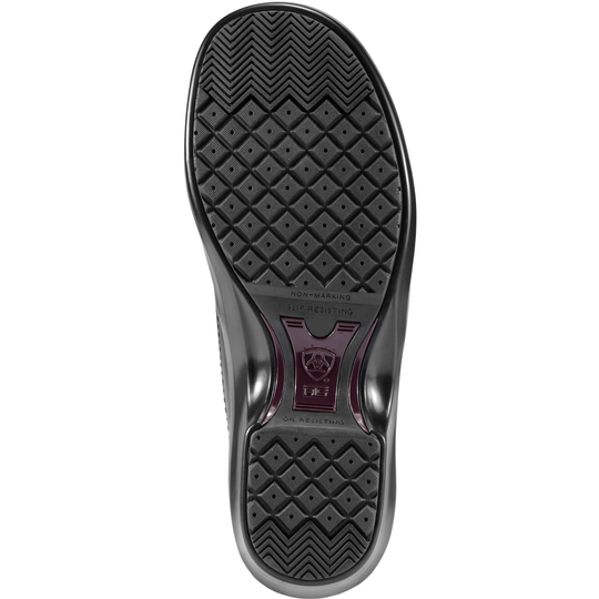 The black rubber outsole of a shoe, featuring a textured diamond pattern and a central red and black logo plate, shown against a plain white background.