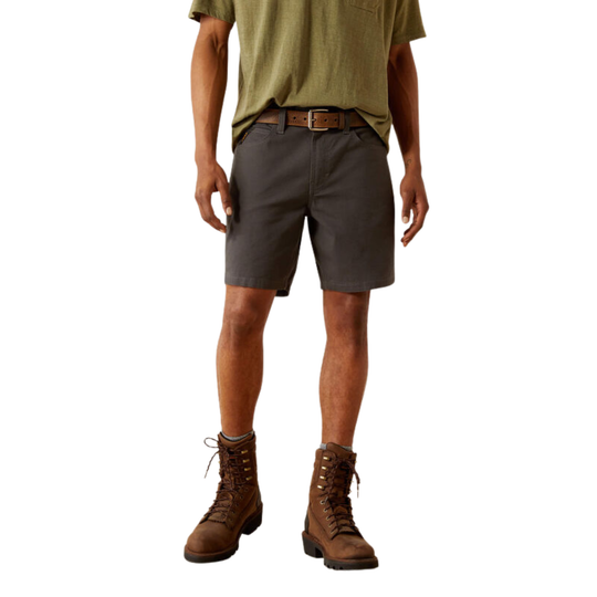 A model from the waist down wearing dark gray cargo shorts, an olive green t-shirt, a brown leather belt, and brown lace-up boots, shown against a plain white background.