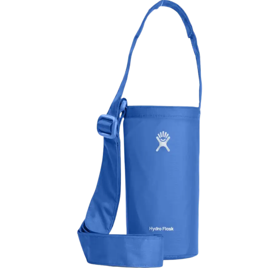 A blue Hydro Flask insulated bottle bag with a shoulder strap and buckle, shown on a plain white background.