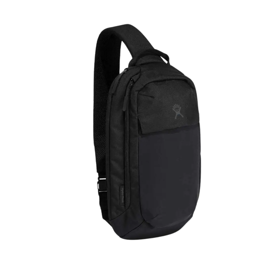 A black sling backpack with a single shoulder strap, shown from a three-quarter angle against a plain white background. The brand Spyder is identified by its signature spider logo on the upper right pocket.