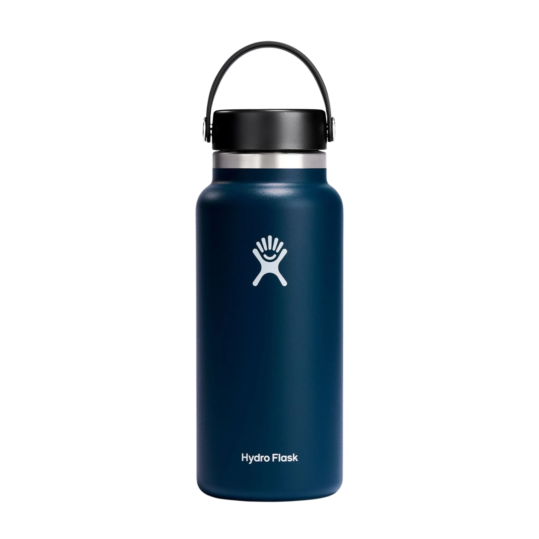 A Hydro Flask insulated water bottle in navy blue with a black lid and handle, featuring the white Hydro Flask logo on the front, set against a plain white background.