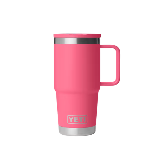 A bright pink YETI travel mug with a stainless steel rim and base, featuring a matching pink lid and handle, shown on a plain white background.
