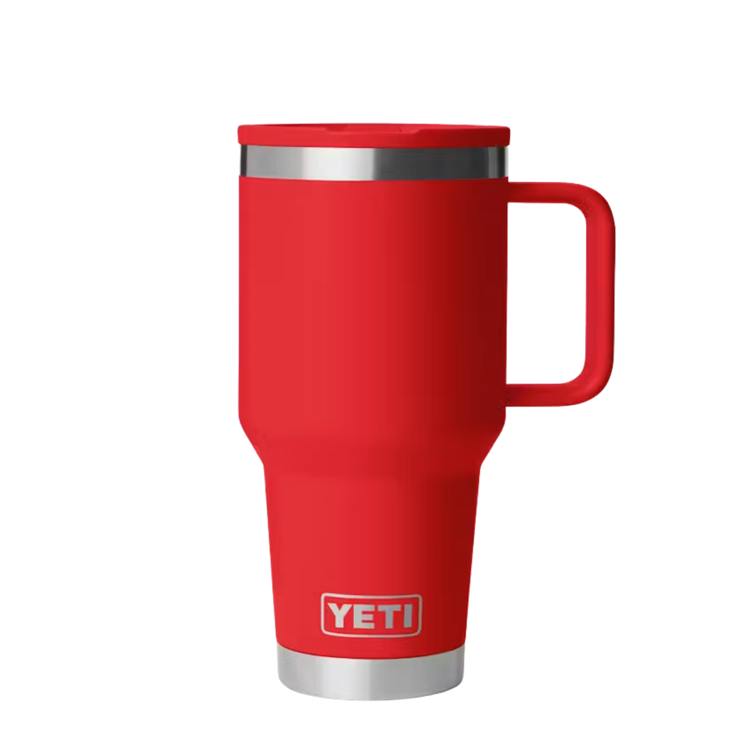 A red YETI travel mug with a stainless steel rim and base, featuring the YETI logo on the front, set against a plain white background.