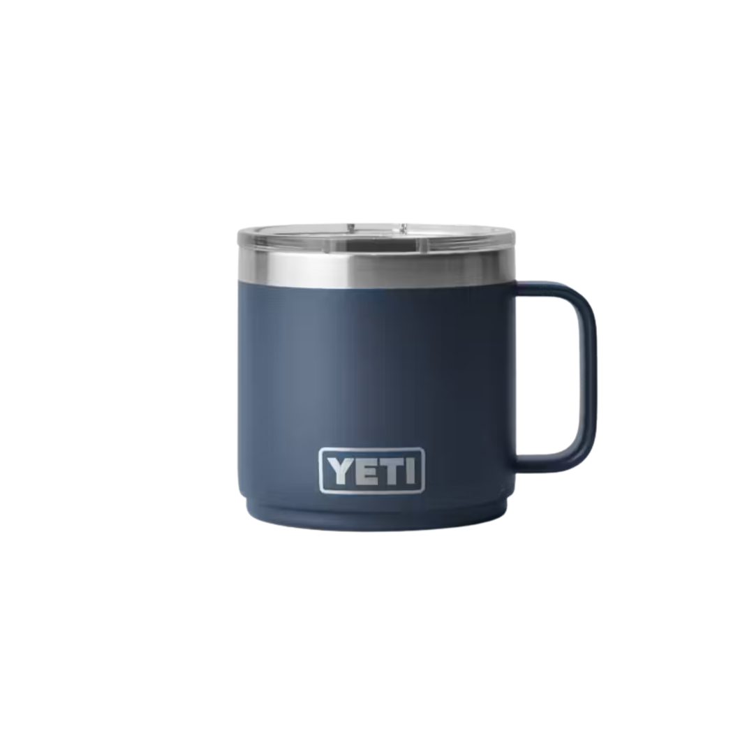 A YETI insulated mug in navy blue with a stainless steel rim and a matching navy blue handle, shown on a plain white background.