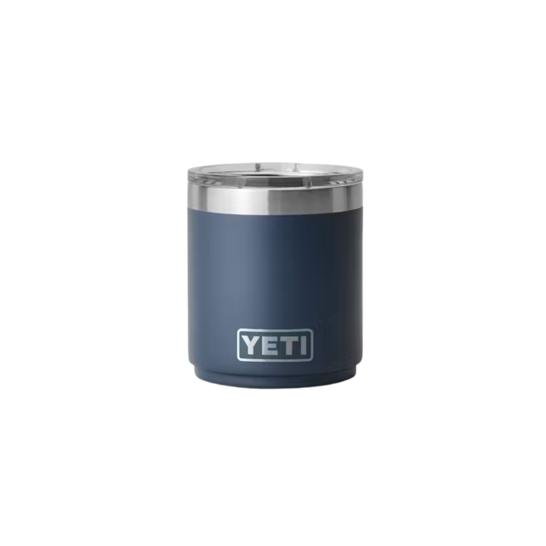 A navy blue YETI insulated tumbler with a stainless steel rim and a white YETI logo on the front, set against a plain white background.