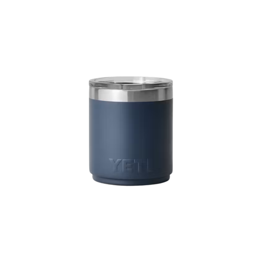 A YETI insulated tumbler in matte navy blue with a stainless steel rim and lid, shown on a plain white background.